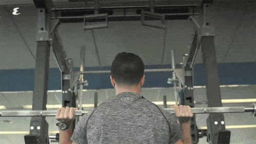 man pressing barbell overhead toward text that appears that says focus areas: