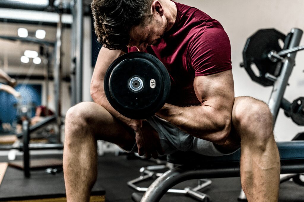 man straining for one more rep