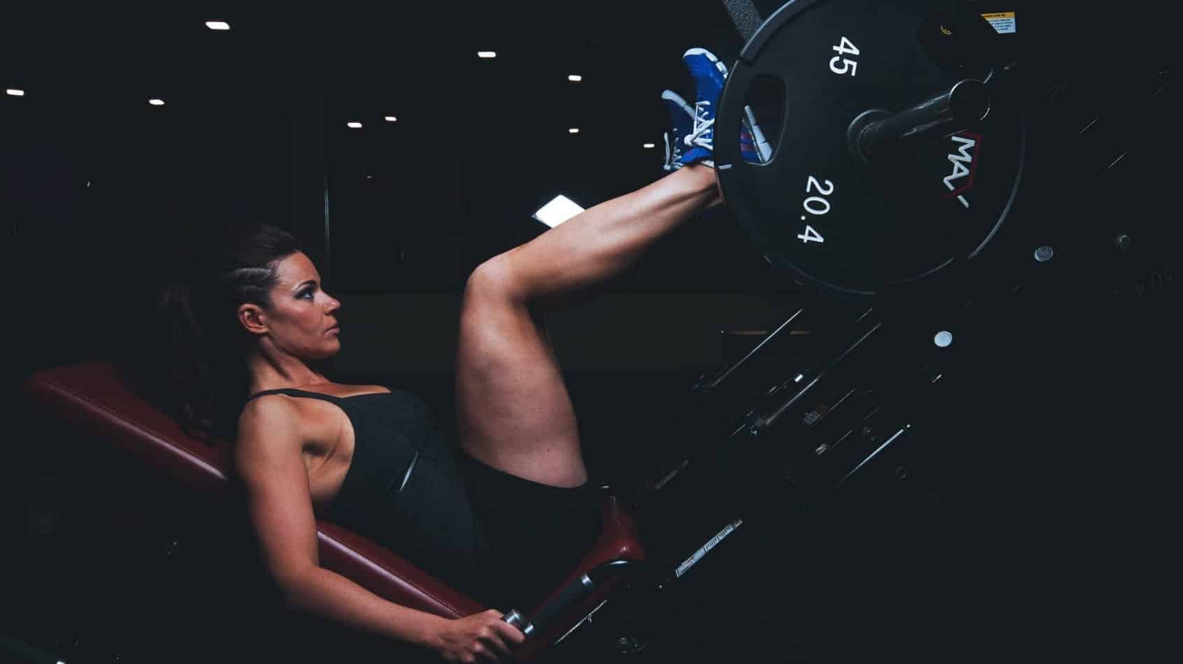 girl getting stronger on the leg press