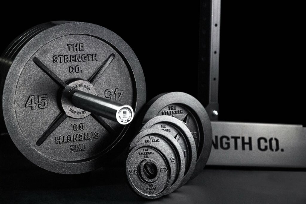 iron plates fitting snuggly on barbell
