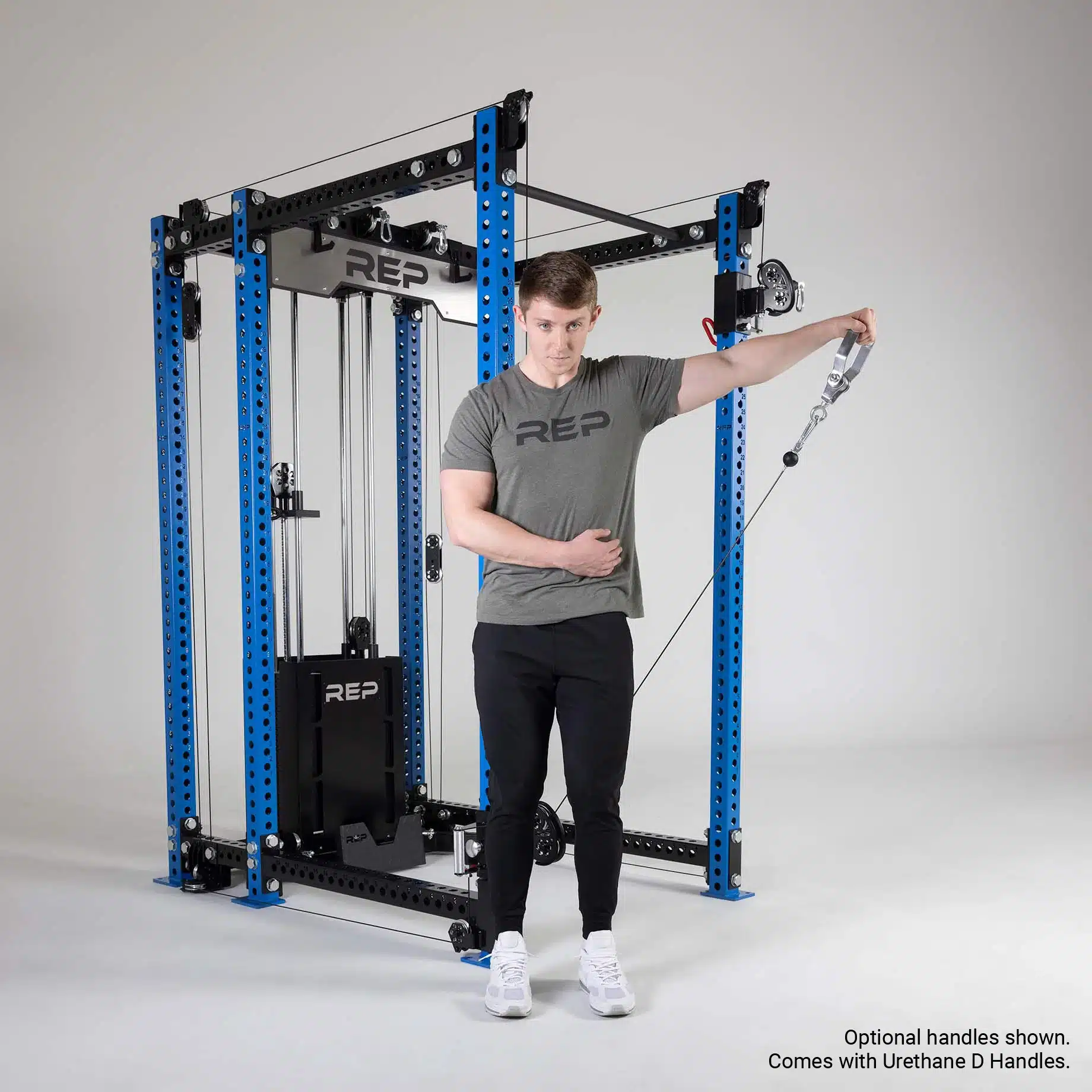 man doing lateral cable raises outside the ares functional trainer