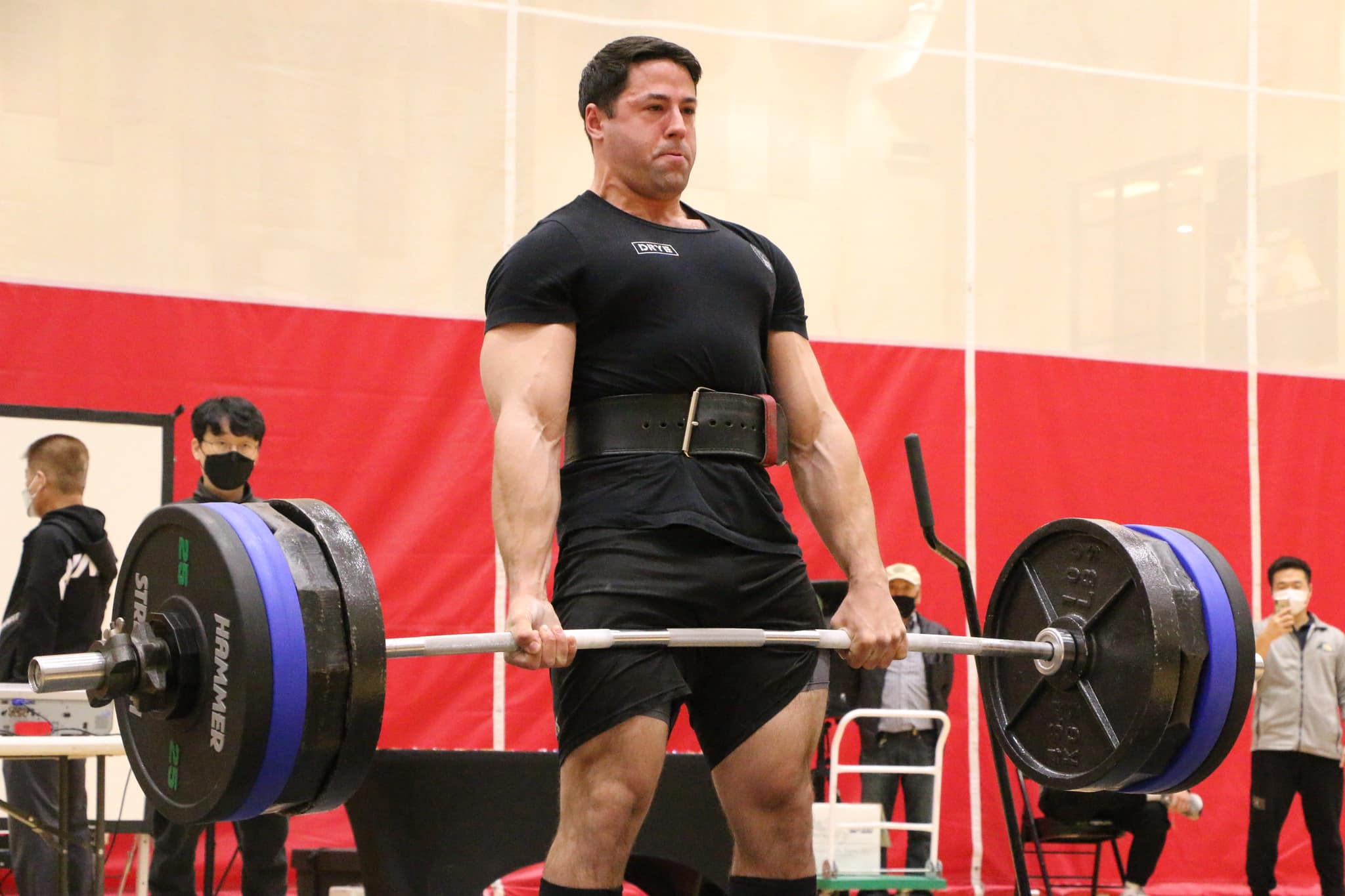 man deadlifting with a deadlift bar
