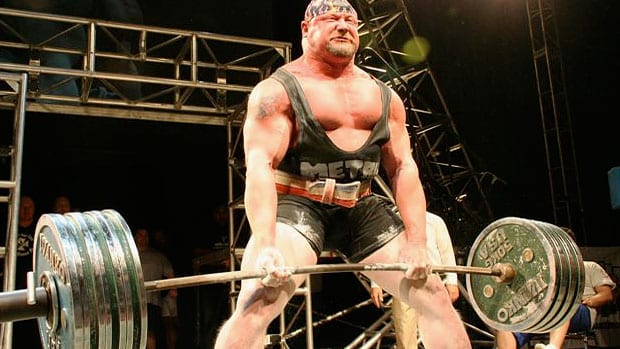 man deadlifting with a deadlift bar
