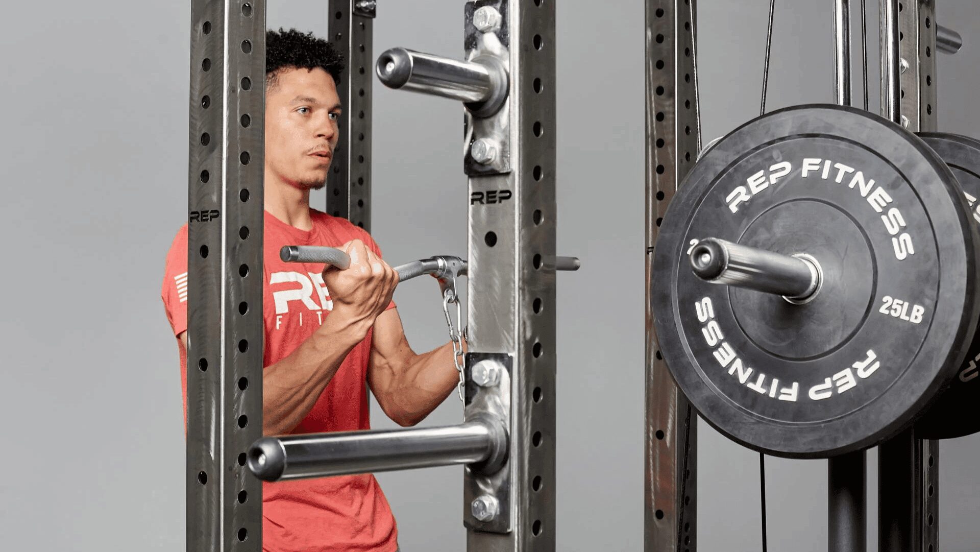 man performing a cable curl with revolving cable curl bar