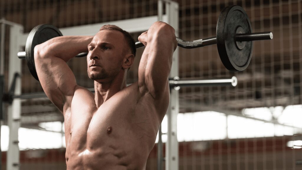 man doing overhead extensions with a curl bar
