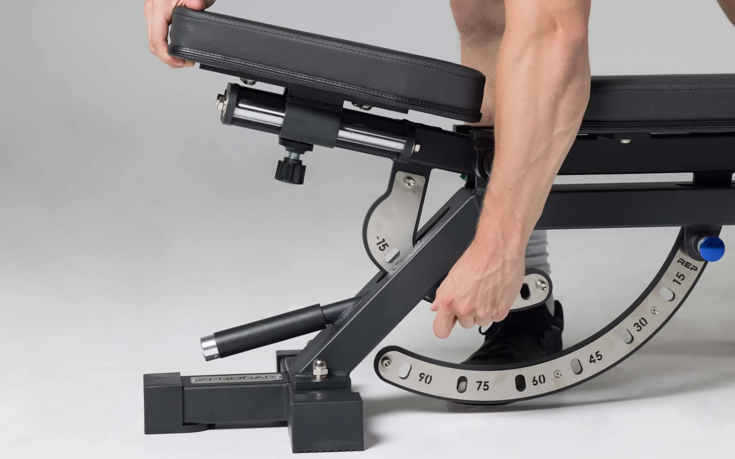 man adjusting seat pad