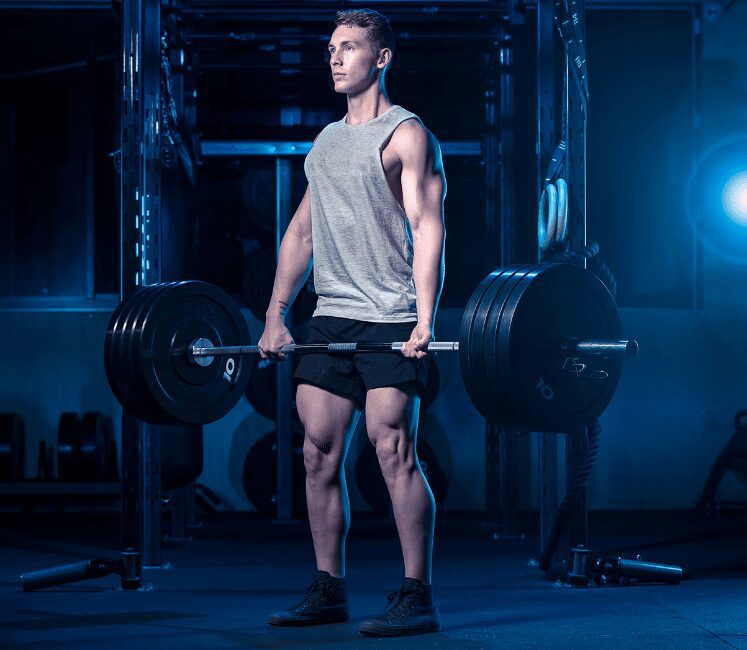 man deadlifting with a mixed grip