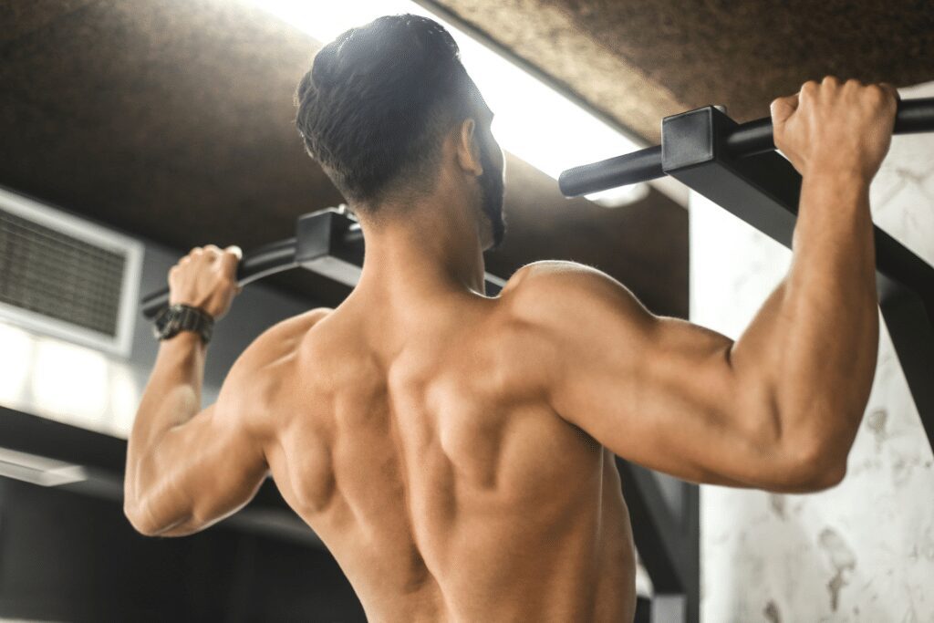 man performing overhand pull ups