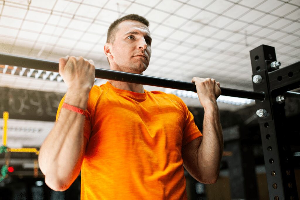 man performing underhand chin ups