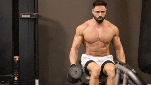 man doing seated lateral raises