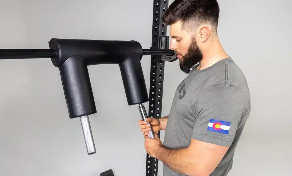 man unscrewing the removable handles