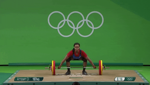olympic lifter performing a snatch
