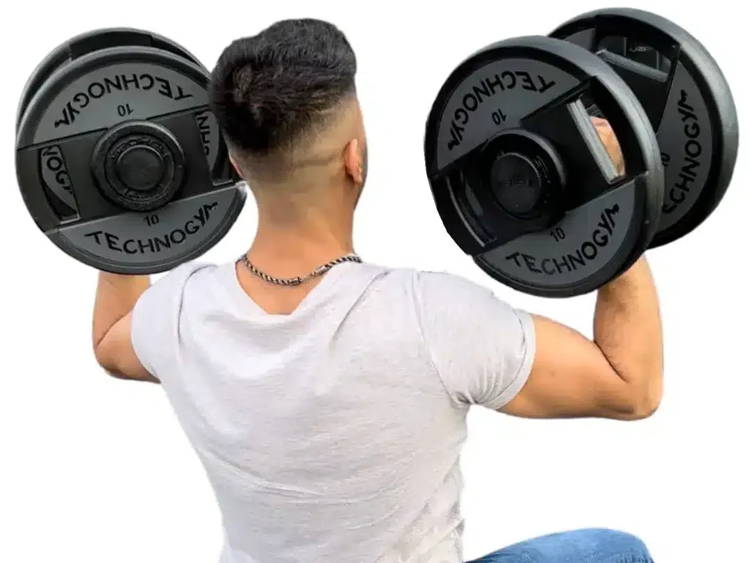 man shoulder pressing the adjustabells