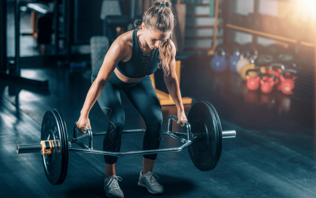 woman doing a trap bar deadlift