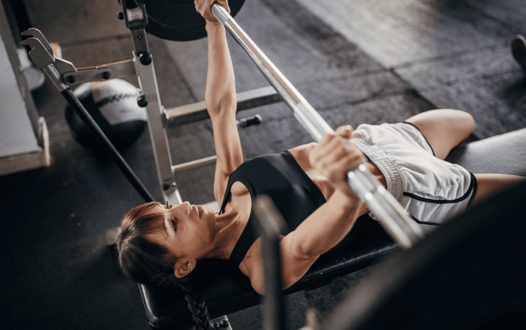 women bench pressing