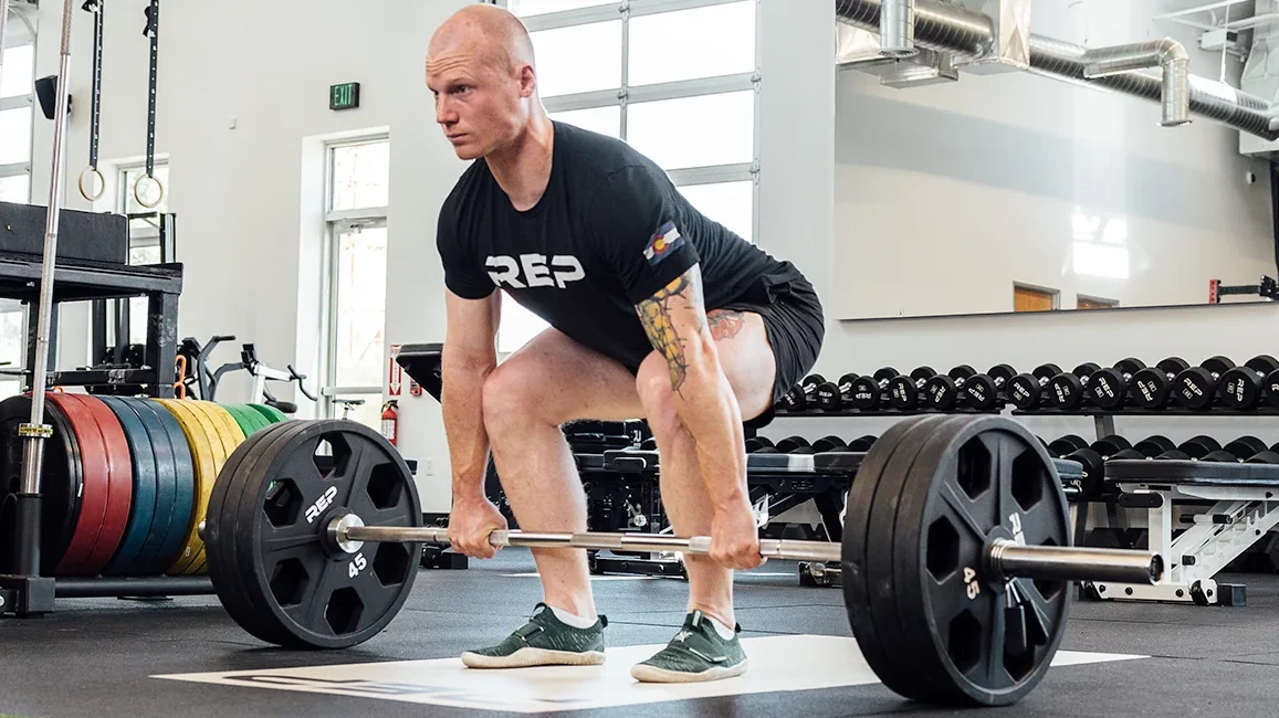 man about to deadlift with rep power bar