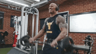 the rock doing a bunch of curls with a bunch of momentum