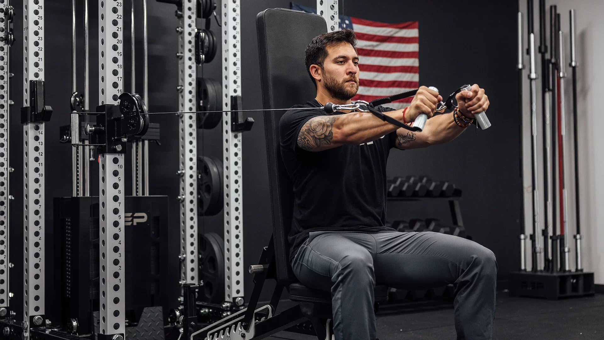 man doing cable presses with ares pulley system