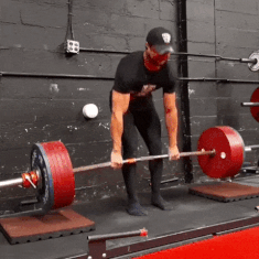 man deadlifting heavy weights
