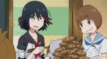 girl in school uniform shoving food in other girls face