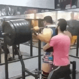 man doing knee bends and the bar snapping in half on his back