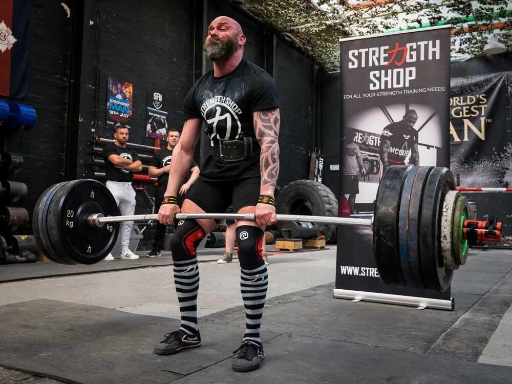 man lifting with the bastard deadlift barbell